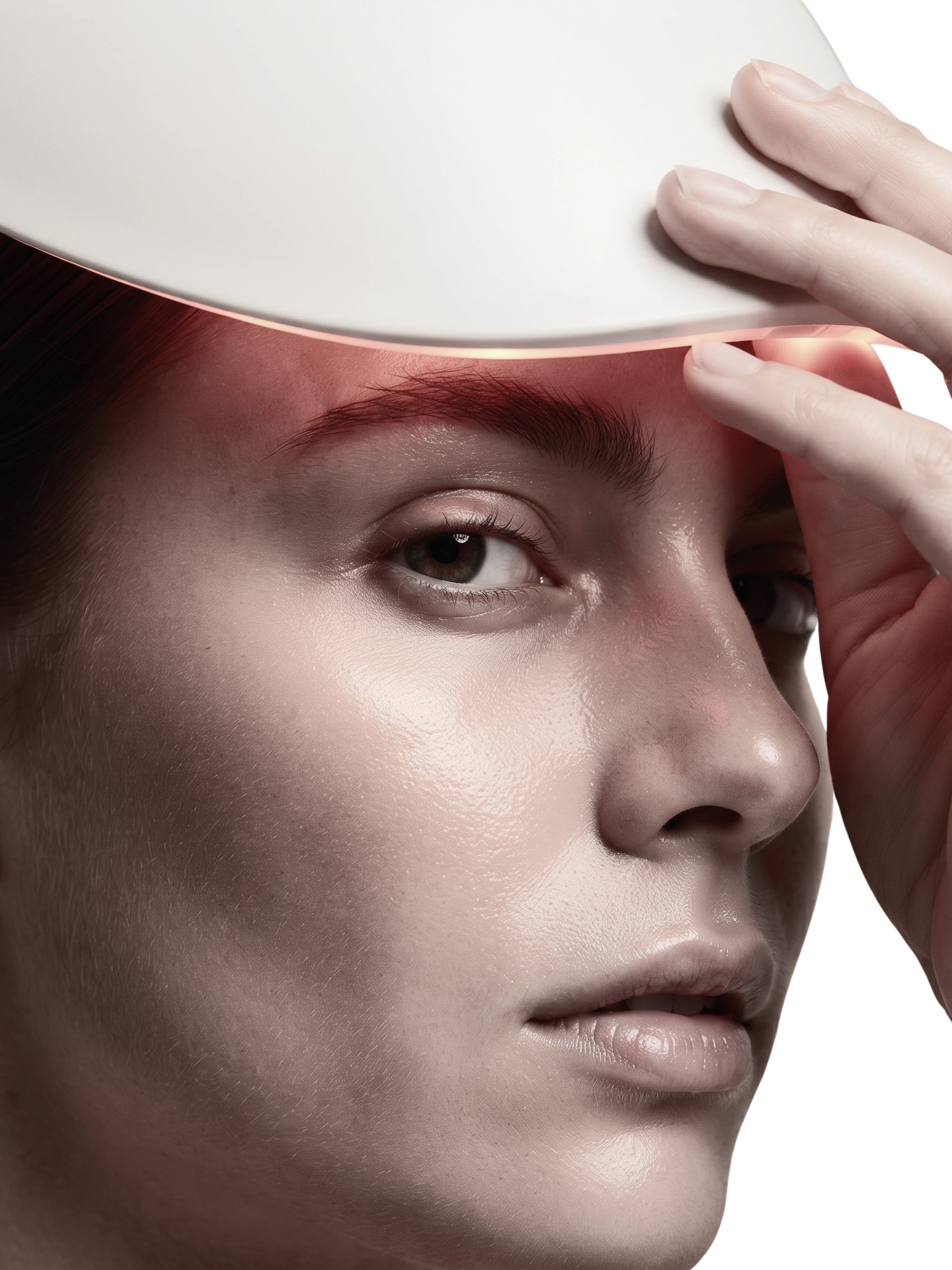 Close-up of a woman's face with a WAVLO Apollo SG white curved light therapy device resting on her forehead, casting a pink-red glow across her brow and upper face against a white background.